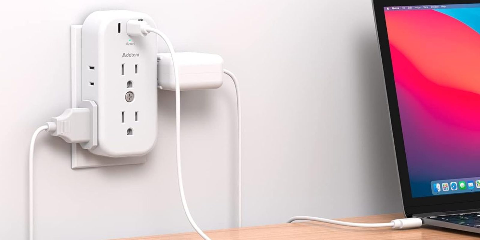 A white electrical outlet with plugs