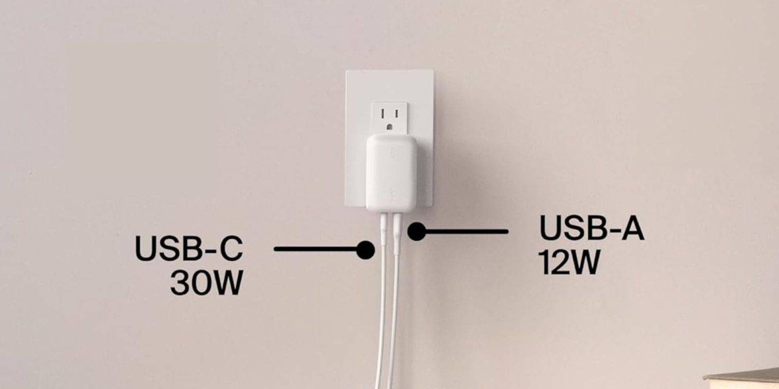 A white electrical outlet with black text