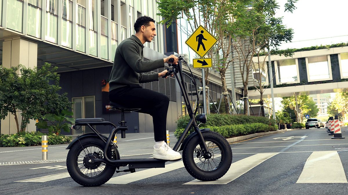 A man riding a scooter