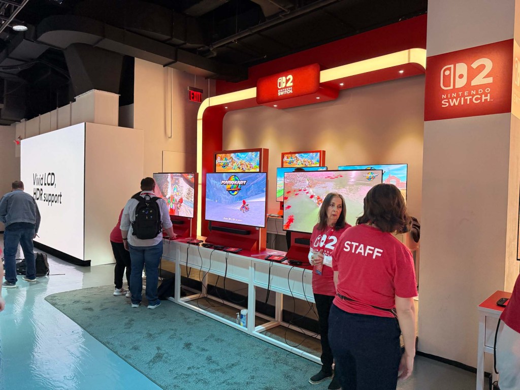 A group of people standing in front of a display