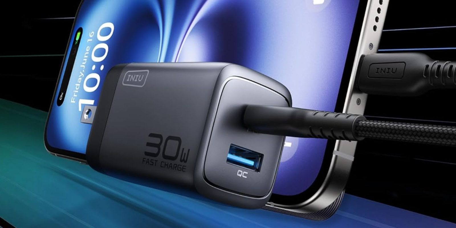 A black charger plugged into a cell phone.