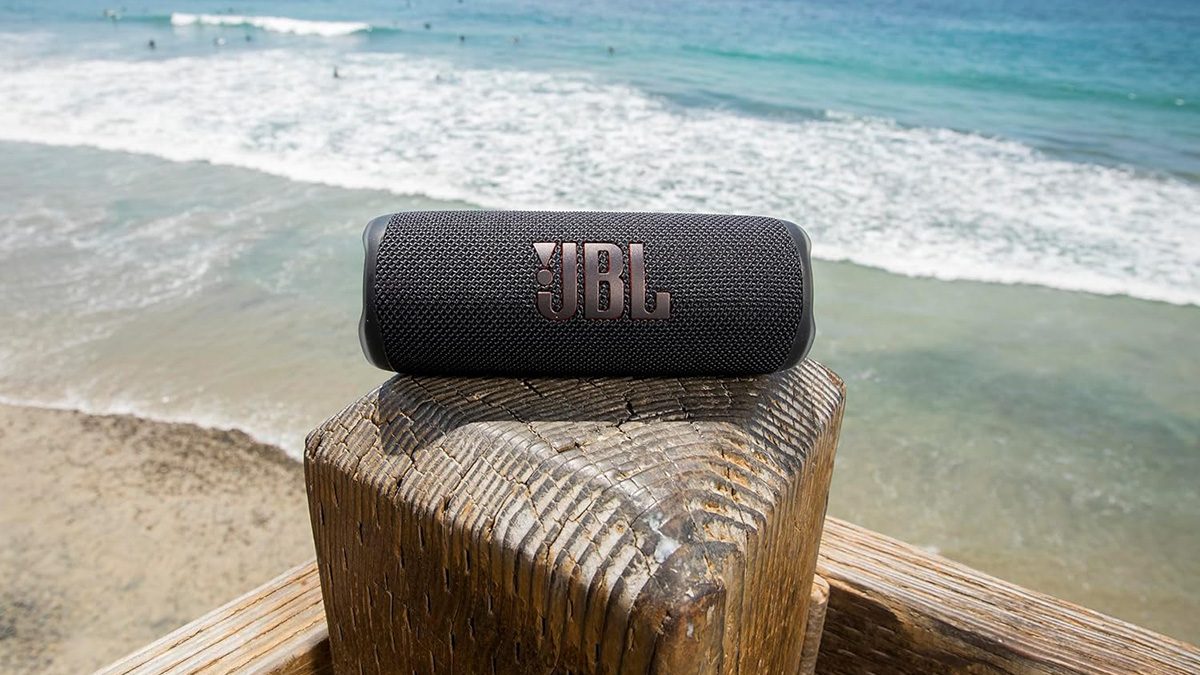 A speaker on a wood post