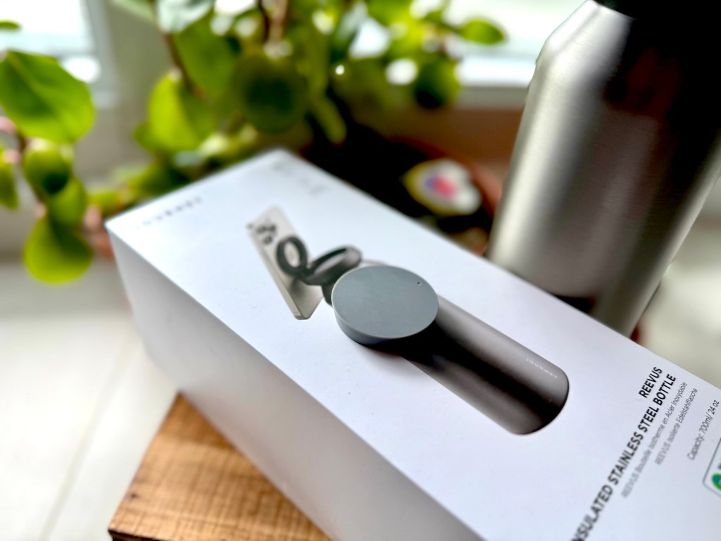 A box with a bottle and a lid on it