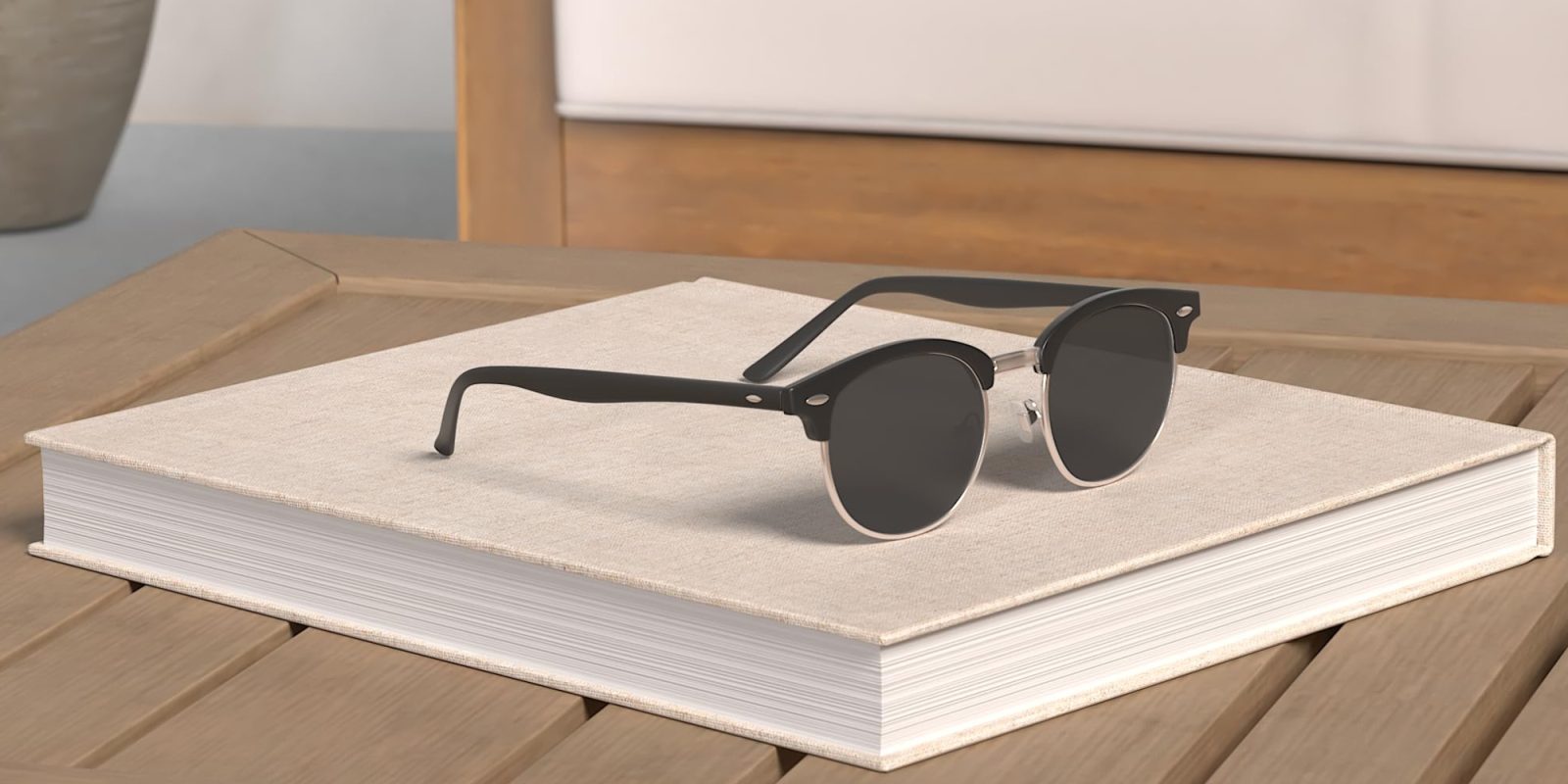 A pair of sunglasses on a book