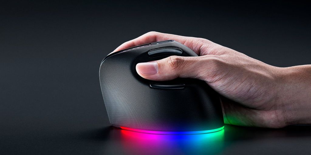 A hand holding a computer mouse