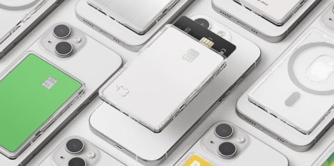 A group of cell phones with a card in the back