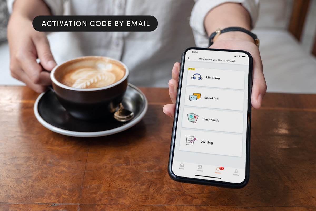 A person holding a phone with a cup of coffee