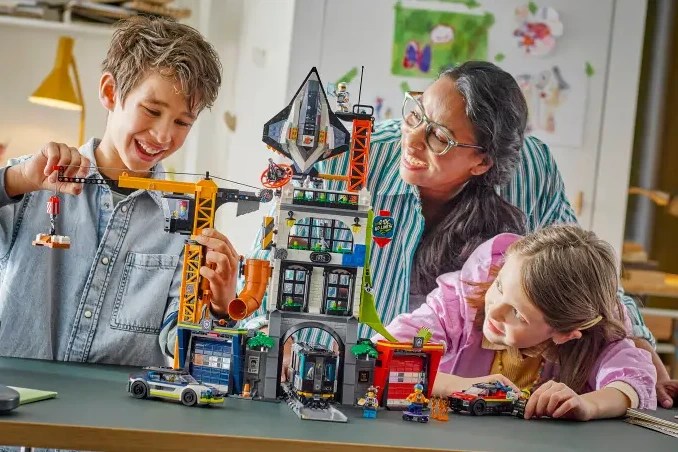 A woman and children playing with toys
