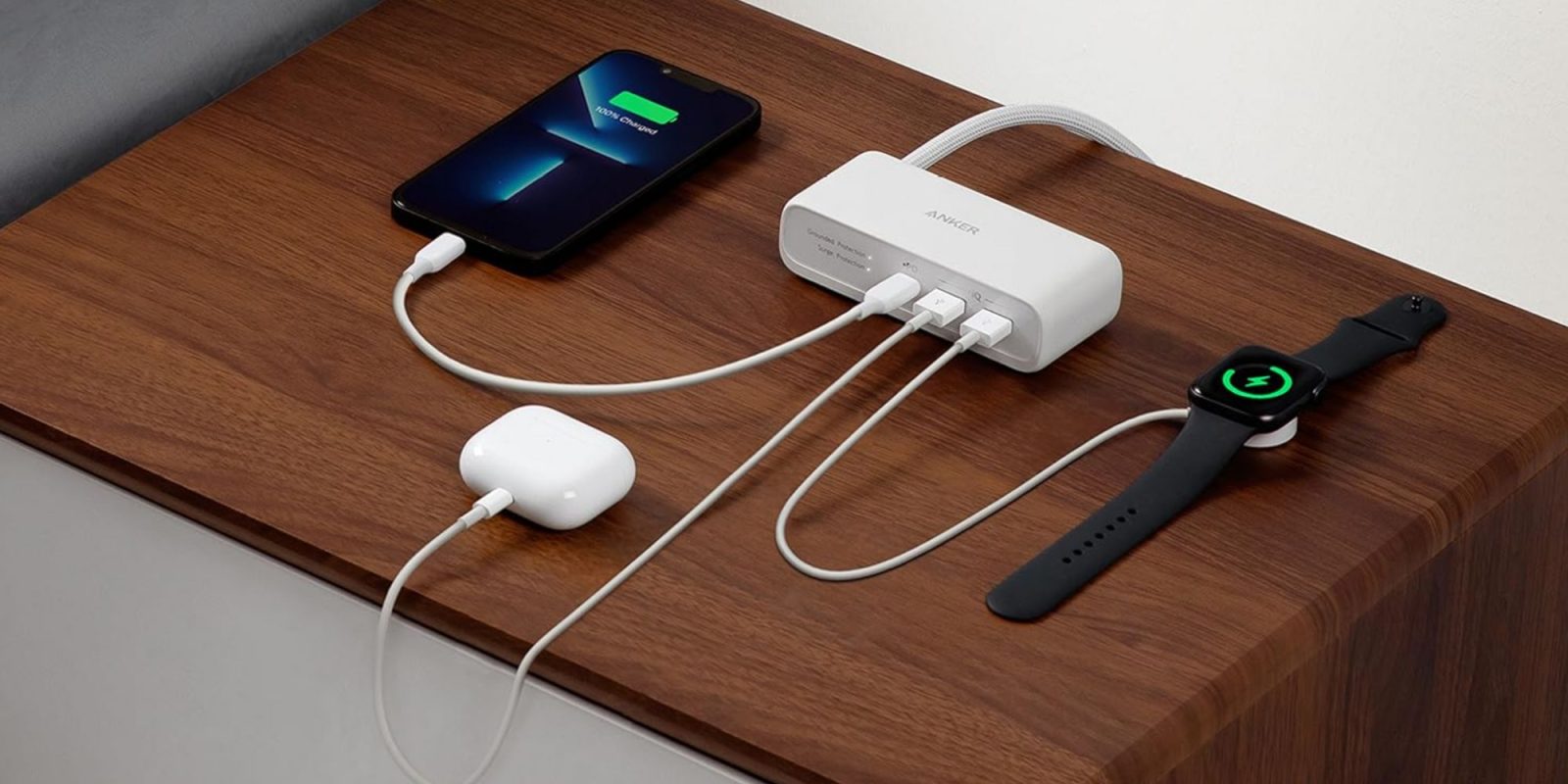 Image showing Anker's 6-in-1 charging station on a bedside table.