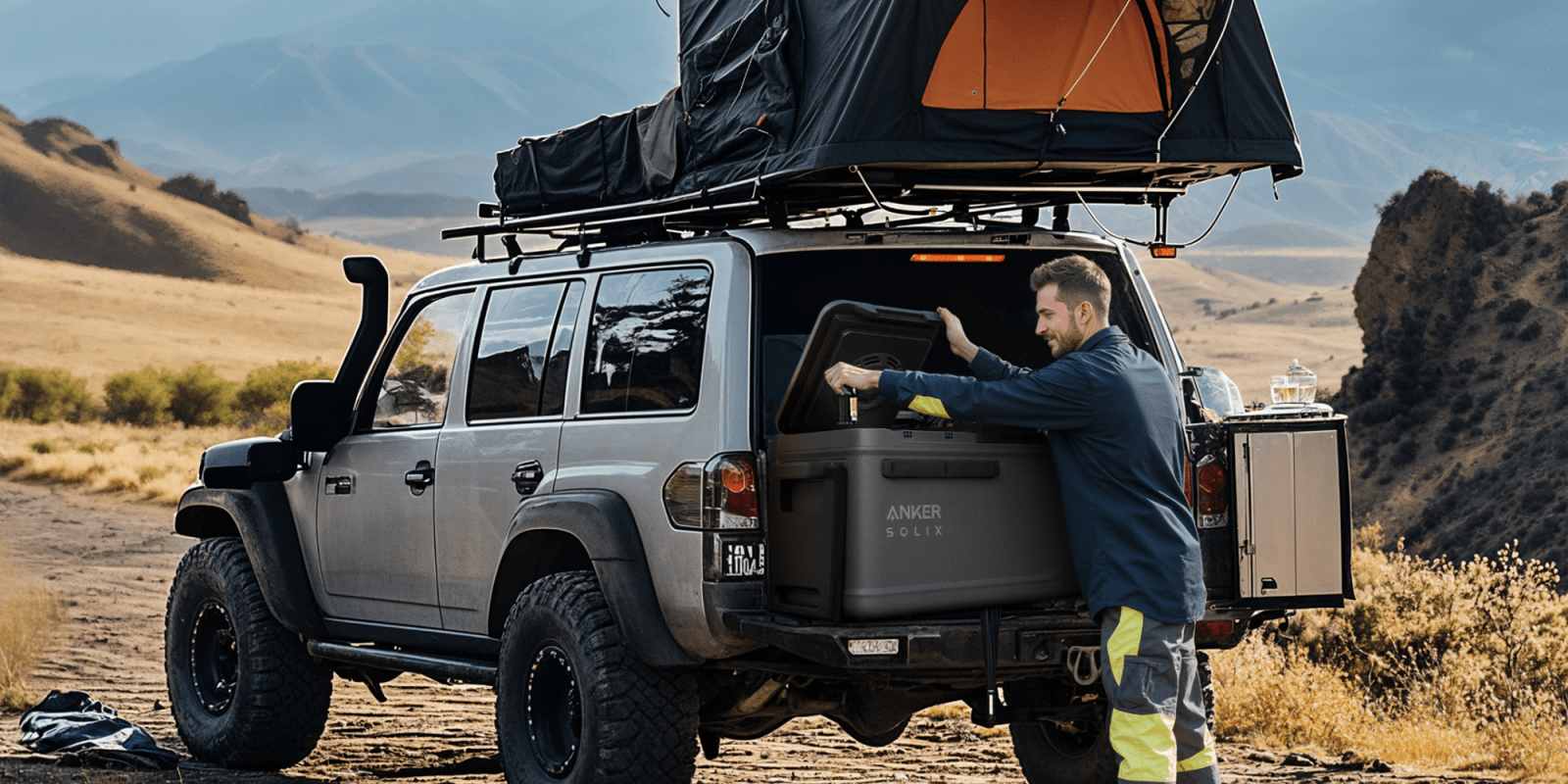 A man opening a box in the back of a car