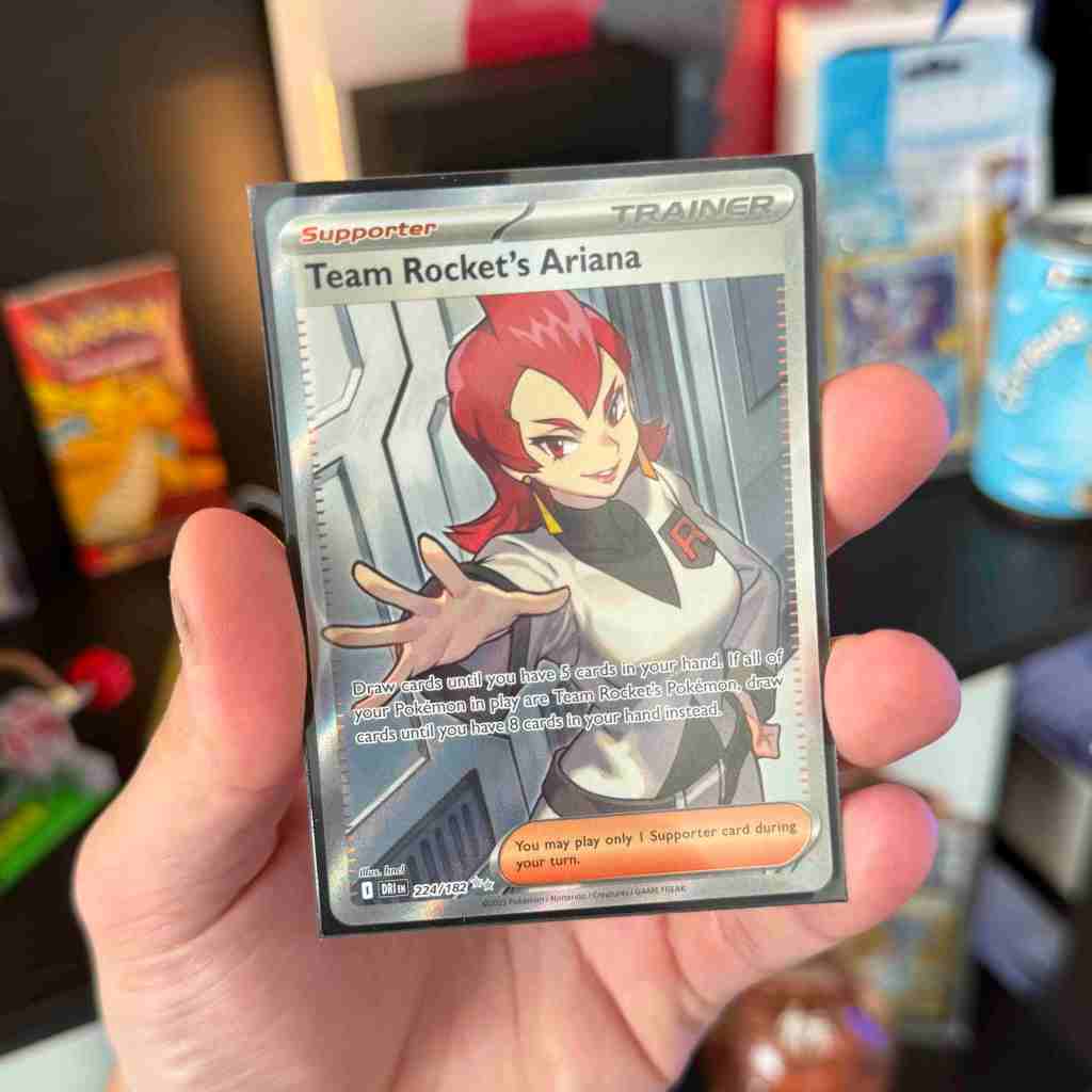 A hand holding a card