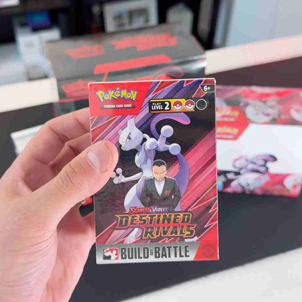 A hand holding a card