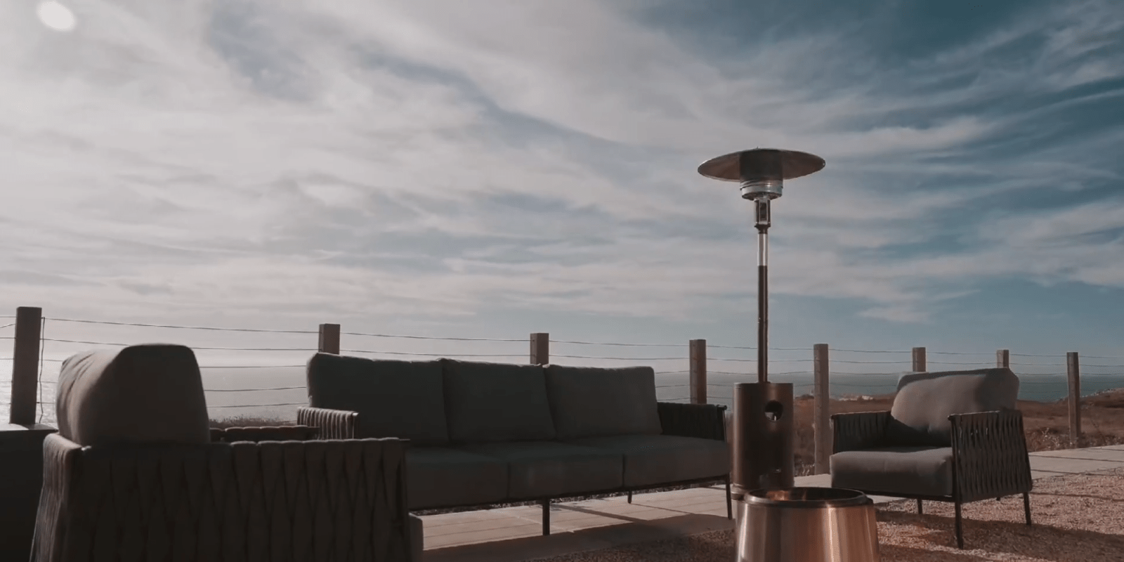 A couch and a fire pit on a deck