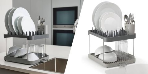 A dish drying rack with plates and forks