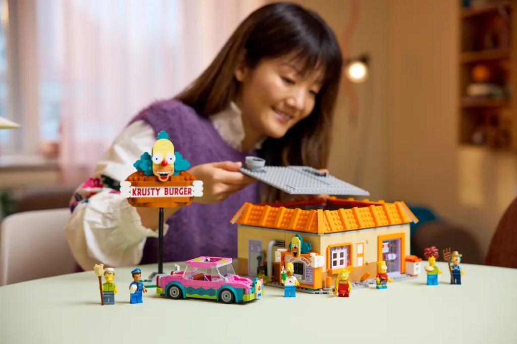 A woman playing with lego toys