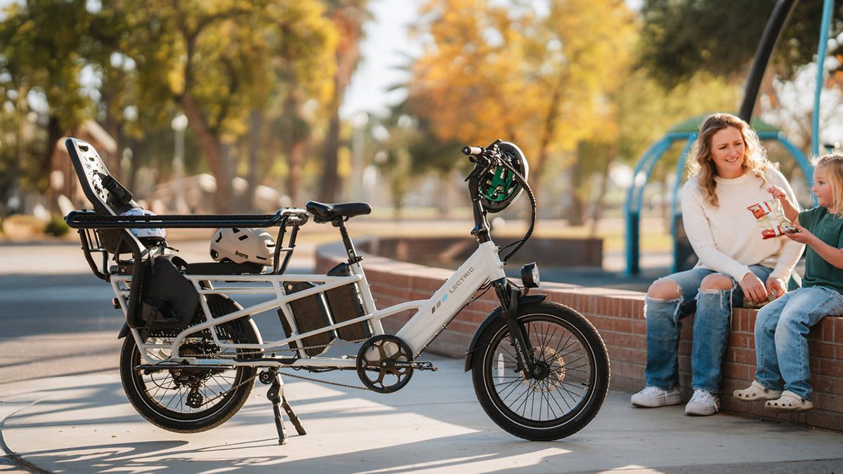 A person standing next to a bicycle