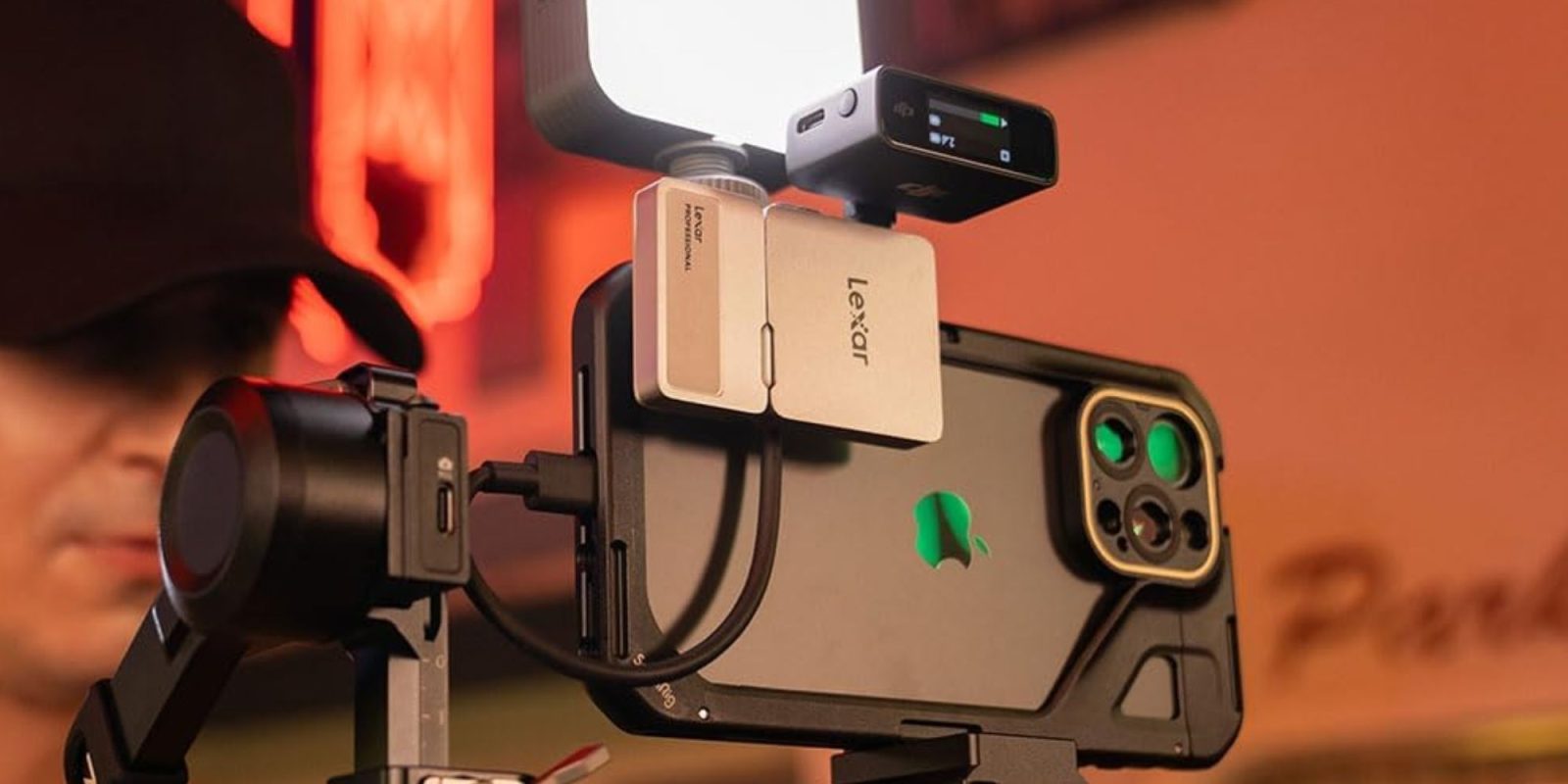 Image showing Lexar's Go portable SSD with hub being used with an iPhone.