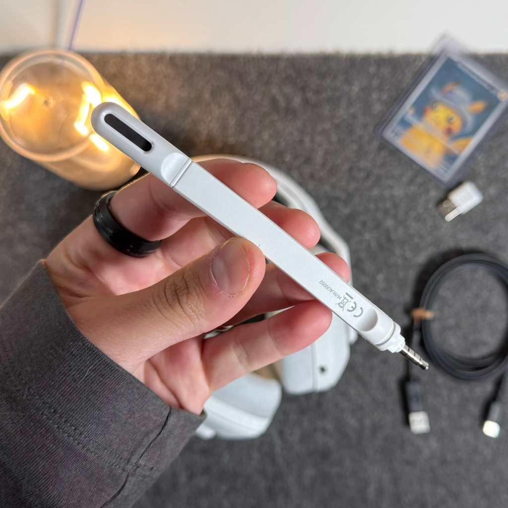 A hand holding a pen