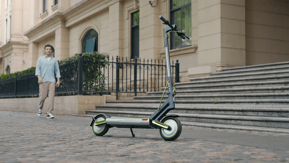 A scooter on a sidewalk