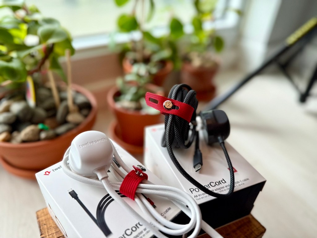 A pair of white and black cords on a box