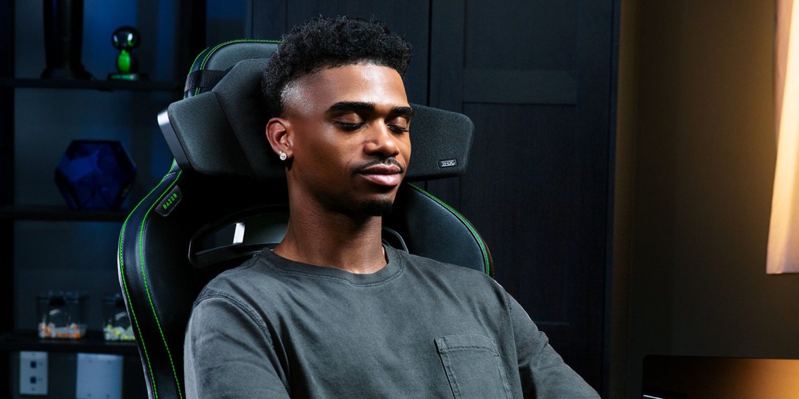 Image showing a person sitting on a gaming chair with Razer's Clio head cushion.