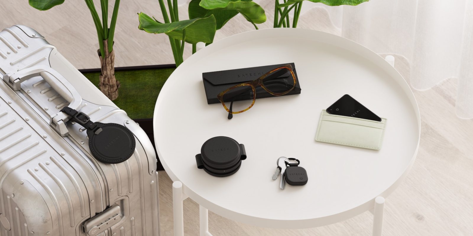 A white round table with a pair of glasses and a wallet on it