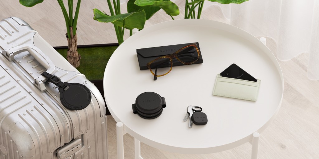 A white round table with a pair of glasses and a wallet on it