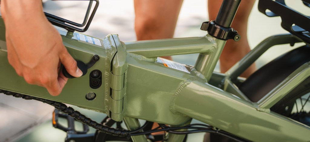 A close up of Lectric's XP4 e-bike's repositioned non-drive side key and charging port