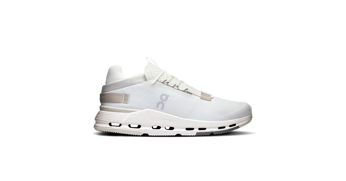 A white shoe with grey sole