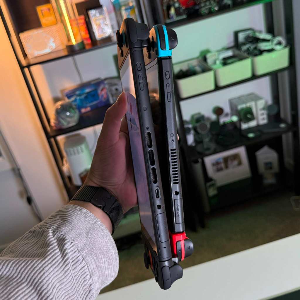 A hand holding a device