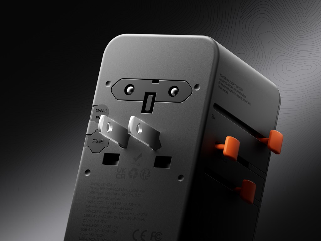 A black box with orange and silver buttons