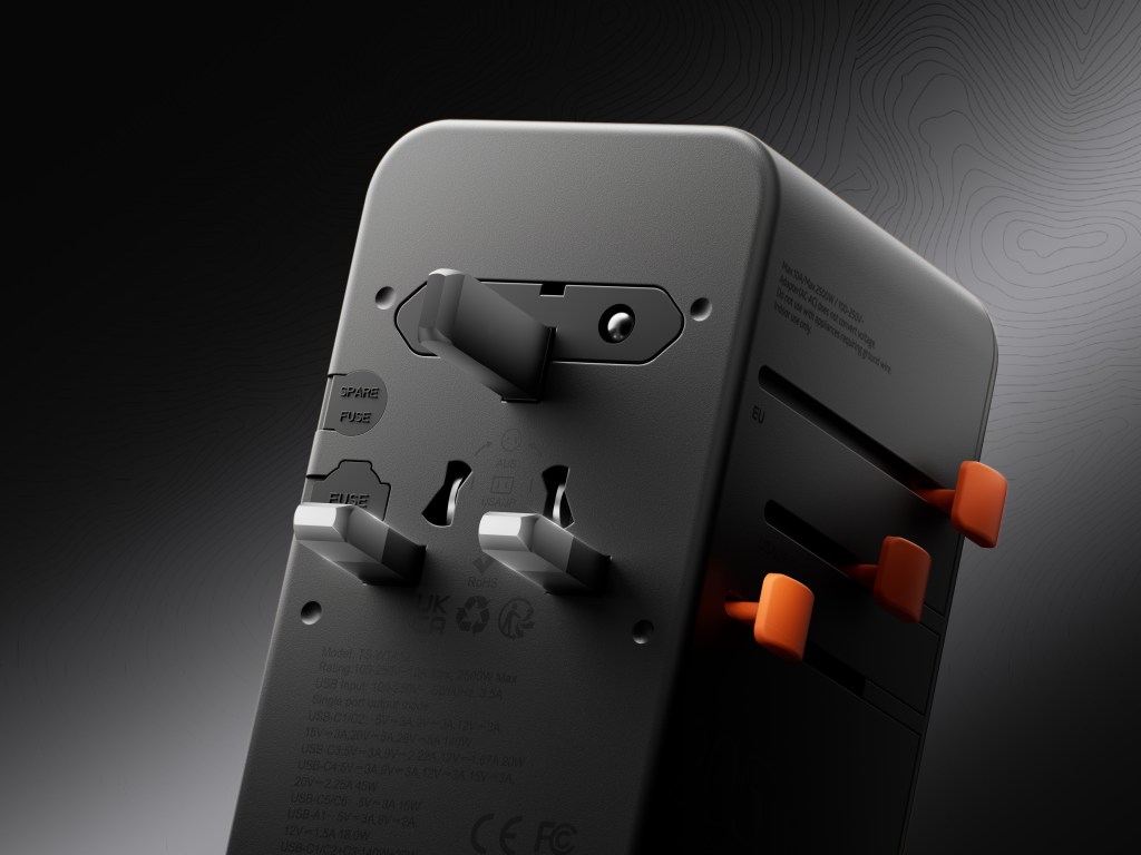 A black rectangular object with orange buttons