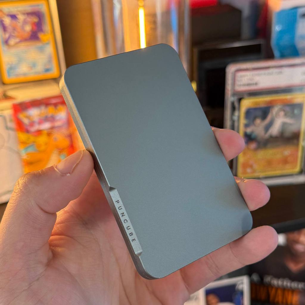 A hand holding a rectangular object