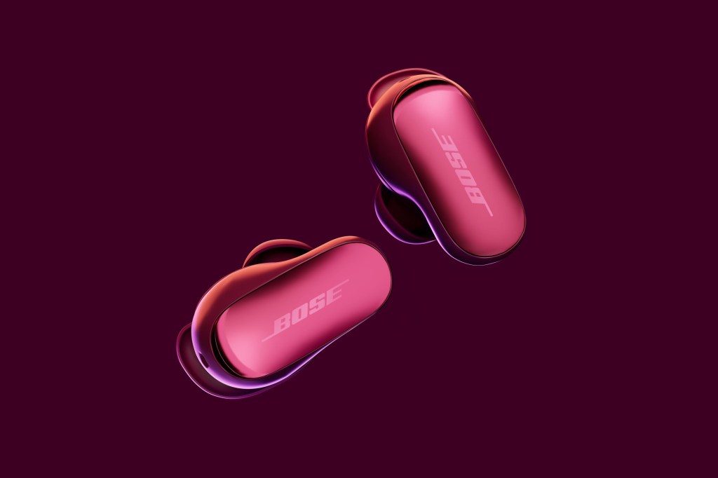 A pair of pink earbuds