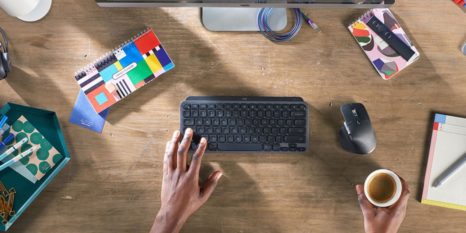 Image showing a person using Logitech's MX Keys Mini keyboard.