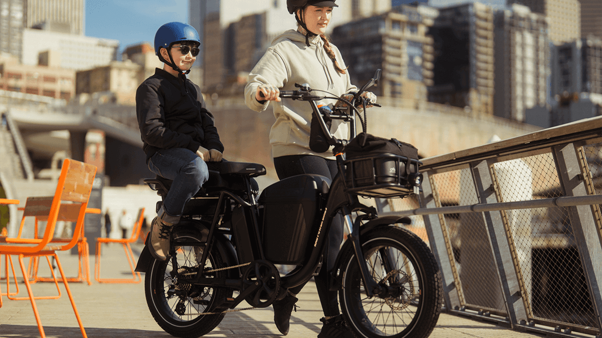 A woman and boy on a motorcycle