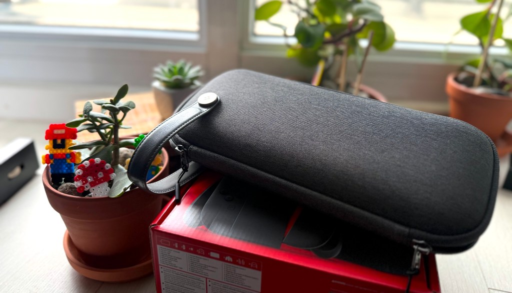 A black bag on a red box