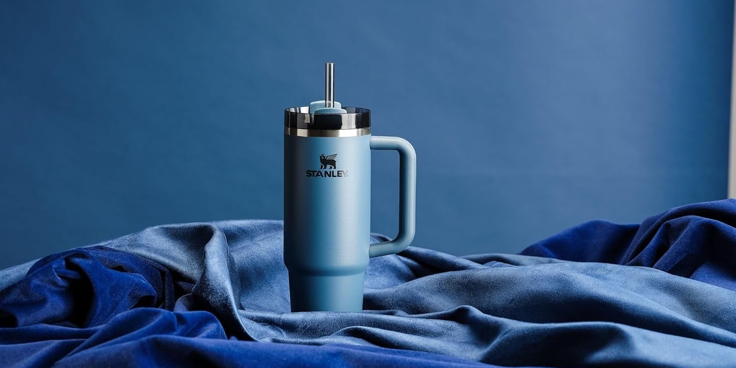 A blue mug with a straw