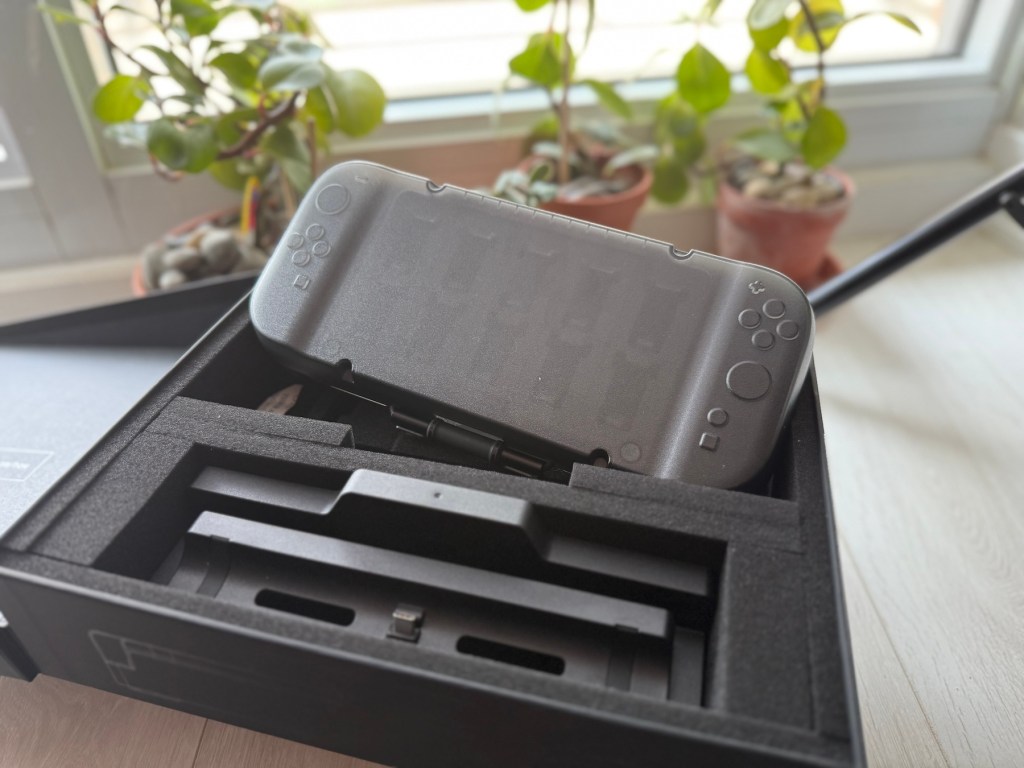 A black gaming device in a box