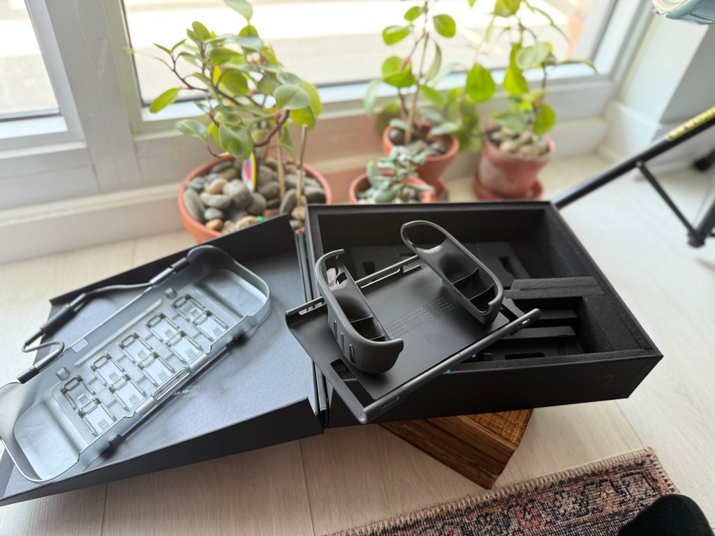 A box with a case and a device in it