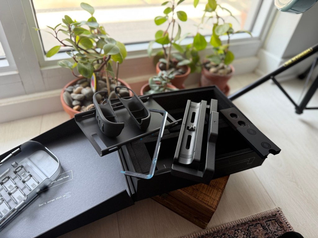 A black box with a black case and a black object on it