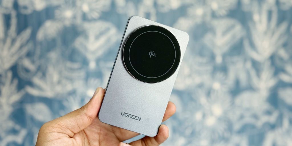 A hand holding a device