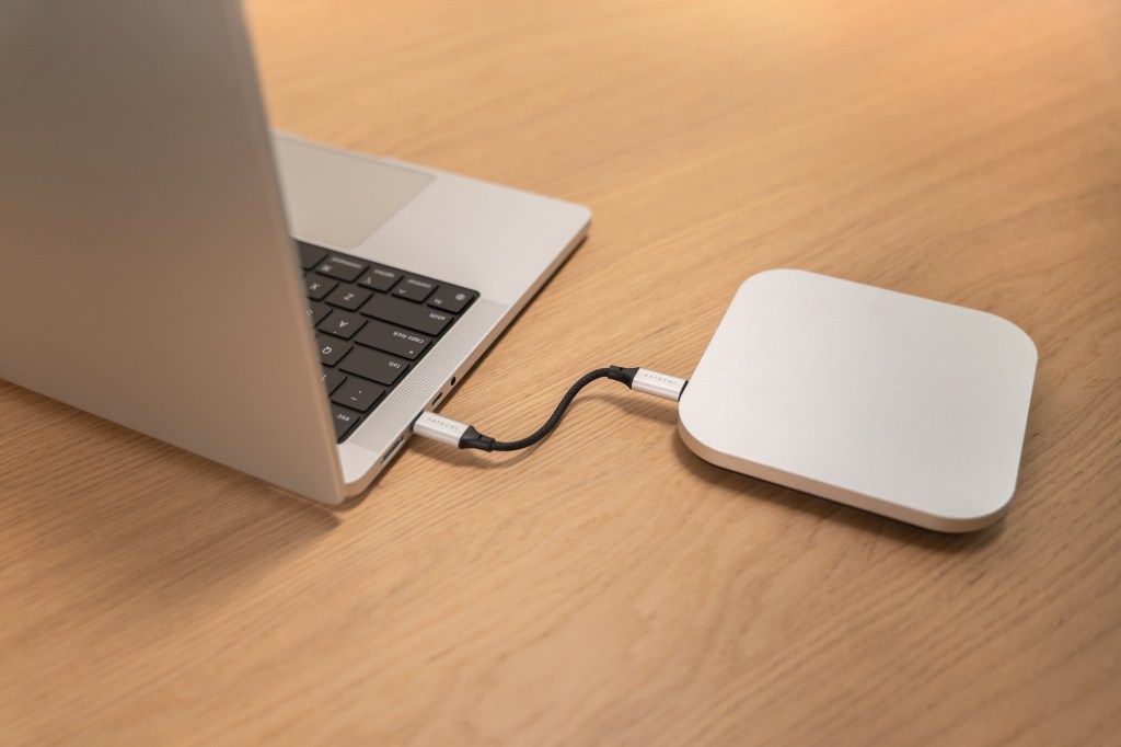 A laptop computer with a power cord