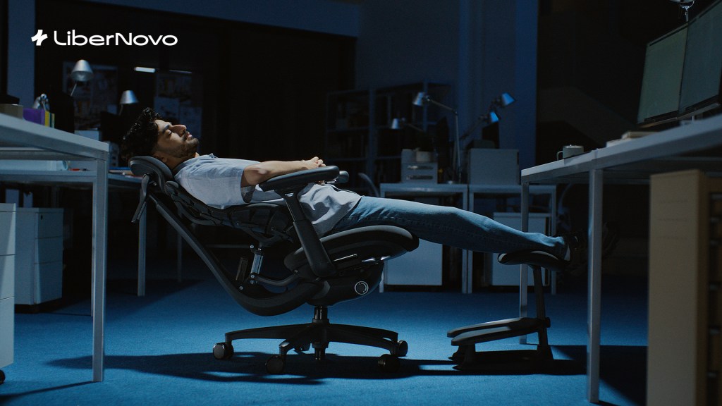 A man lying in a chair