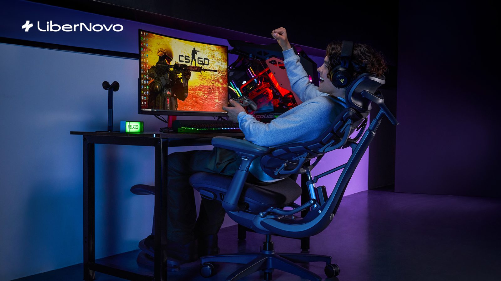 A man sitting in a chair playing a video game