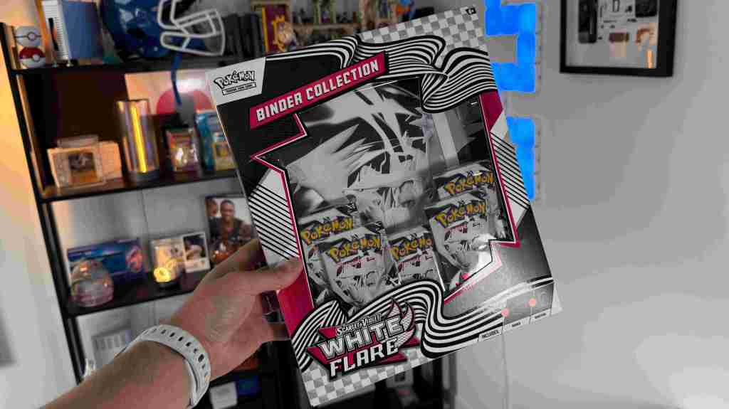 A hand holding a box of cards