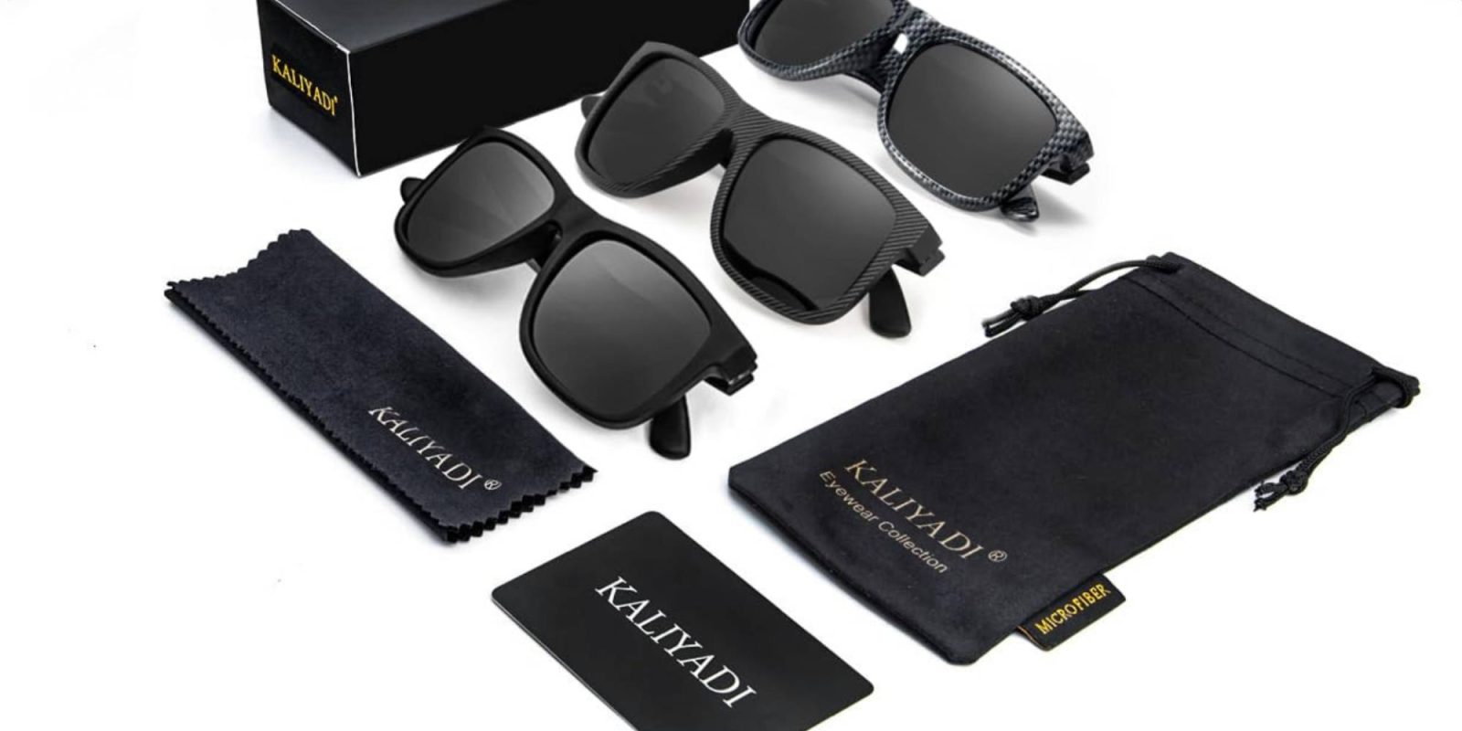 A group of sunglasses and a black bag