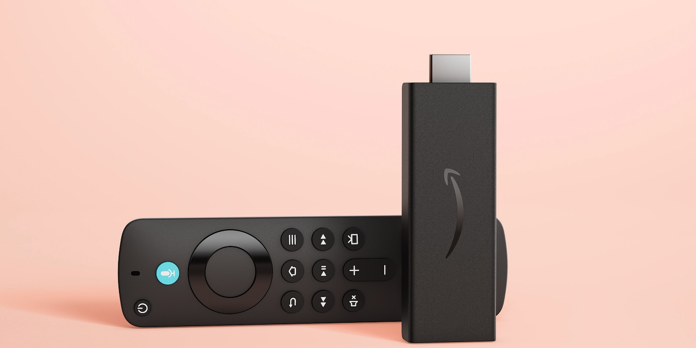 A remote control next to a device