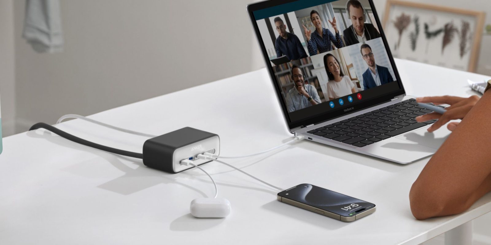 A laptop and phone connected to a power bank