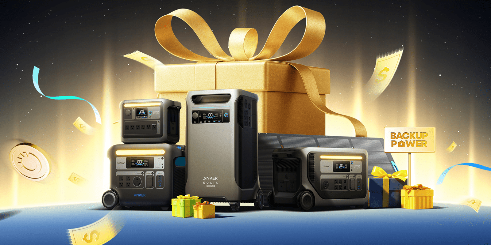 A group of electronic devices next to a large gold present